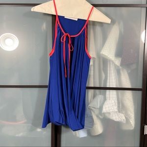 Amanda Uprichard blue tank with red trim.